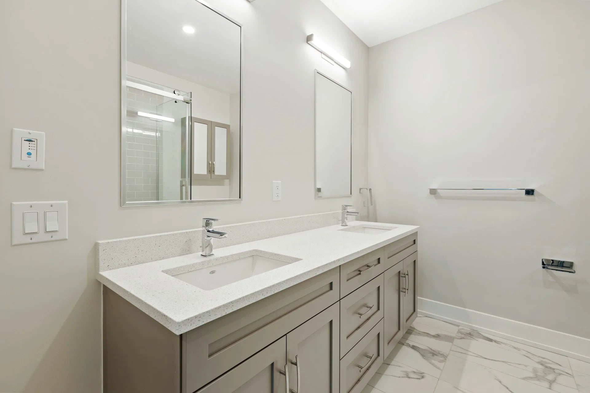 Bathroom with a vanity, sink, and mirror in a modern design. Gallery - Quality Home Distribution